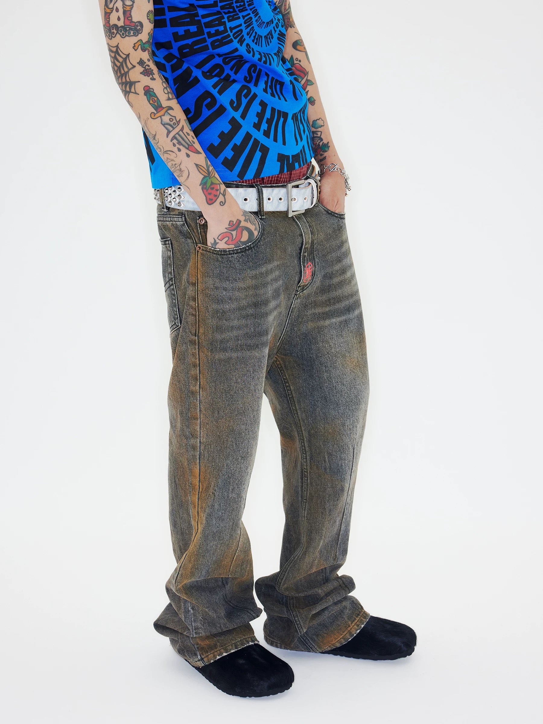 CHAI rust effect distressed jeans model front view