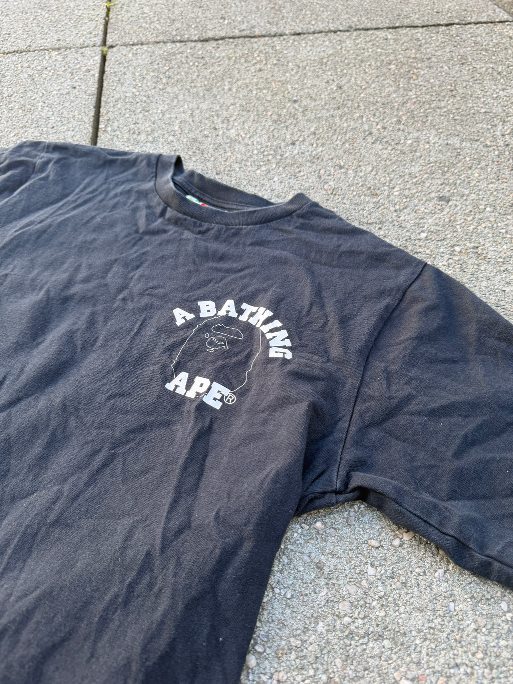 A BATHING APE – 1st Camo Face Over College Tee (Black)