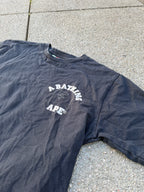 A BATHING APE – 1st Camo Face Over College Tee (Black)