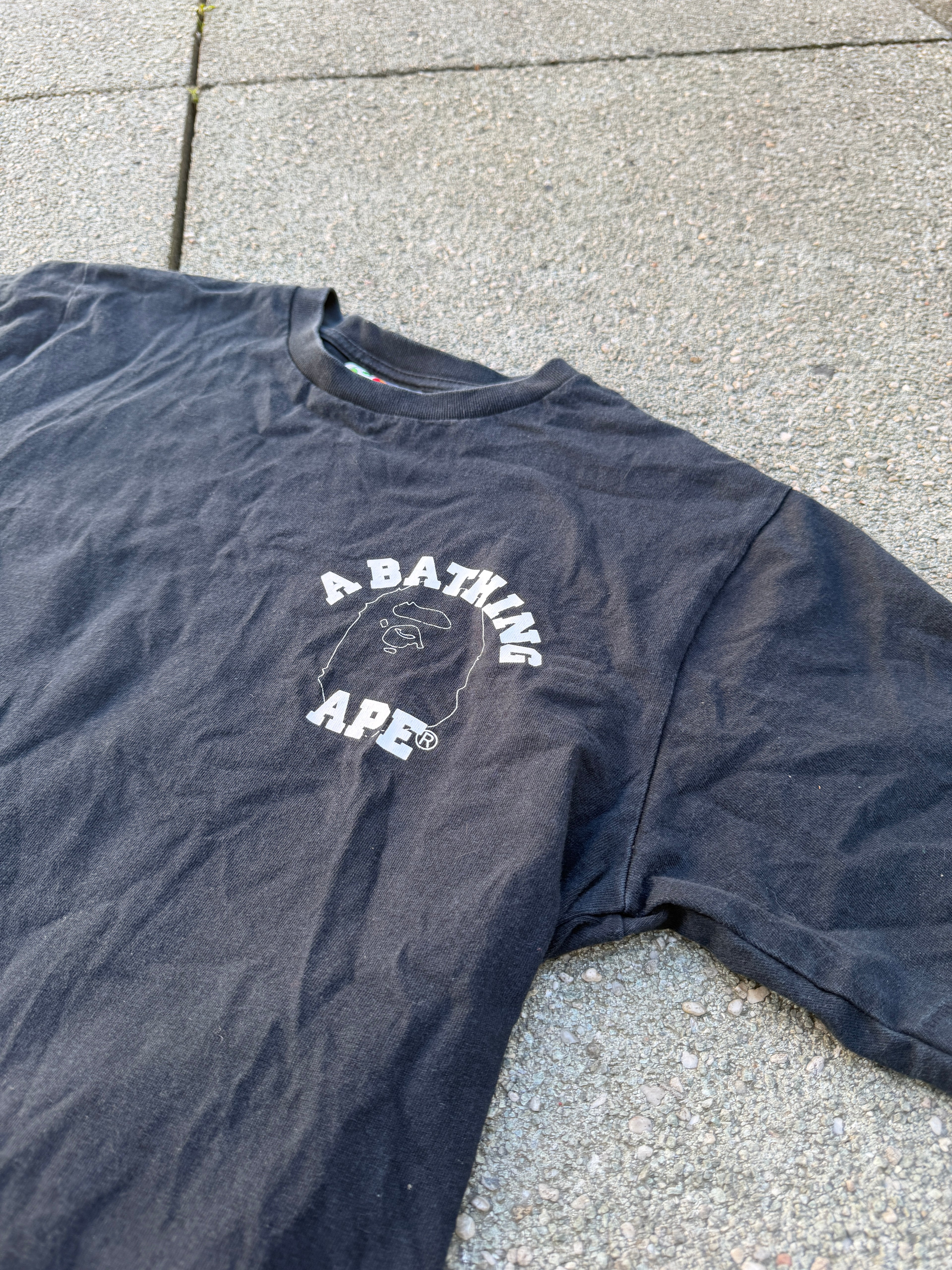 A BATHING APE – 1st Camo Face Over College Tee (Black)