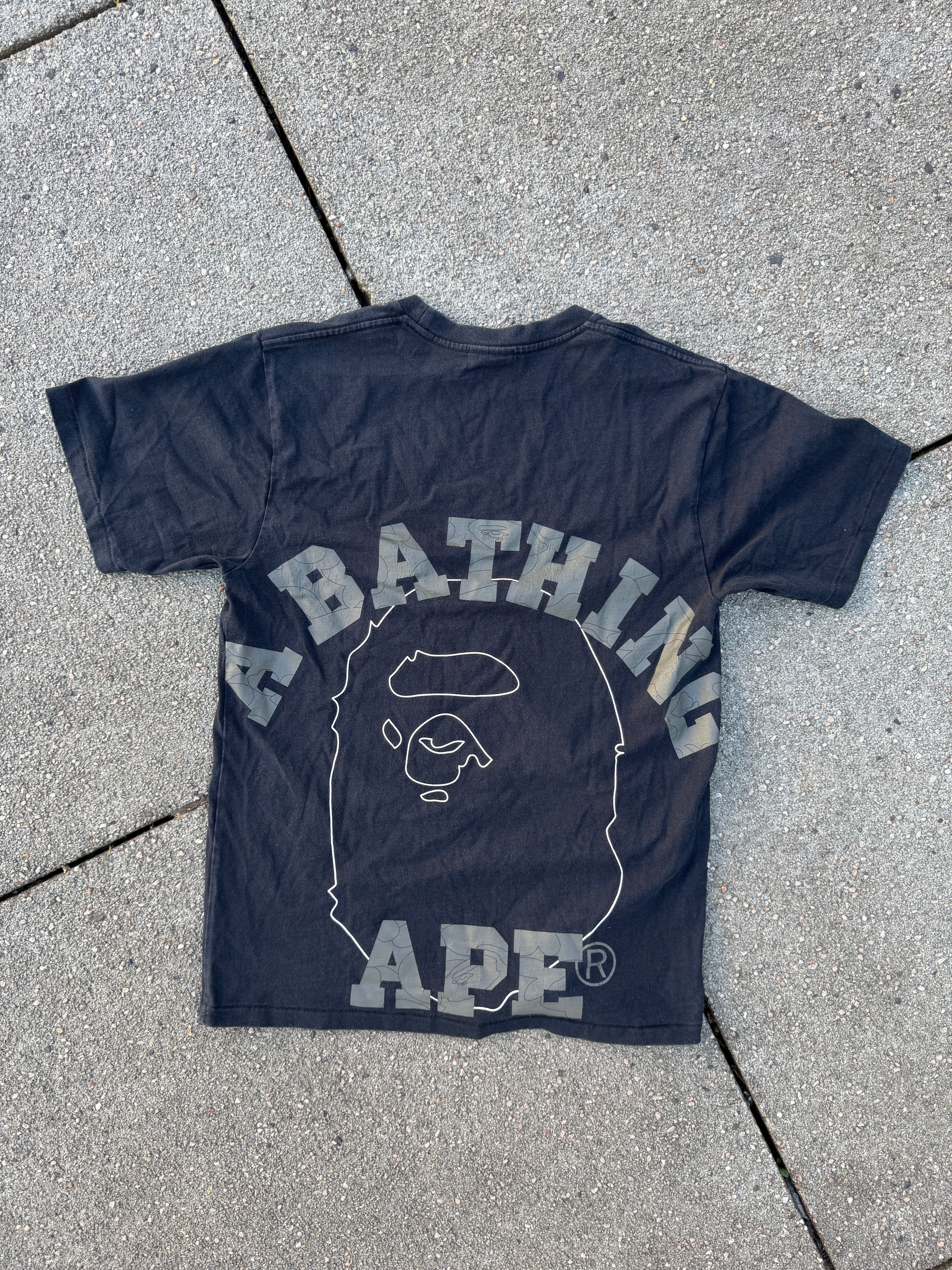 A BATHING APE – 1st Camo Face Over College Tee (Black)