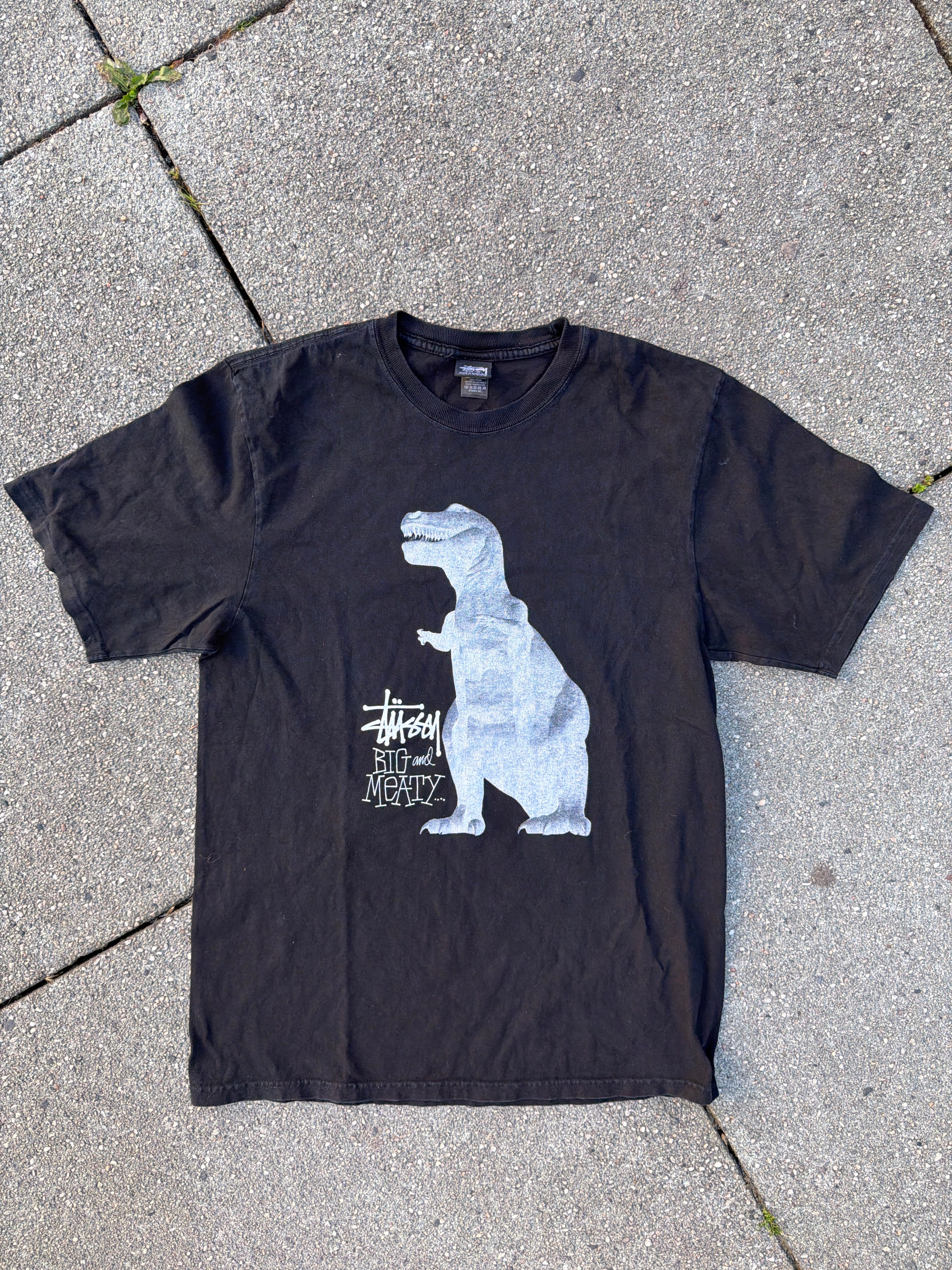 Stüssy – T-Rex „Big and Meaty" Pigment Dyed Tee (Black)