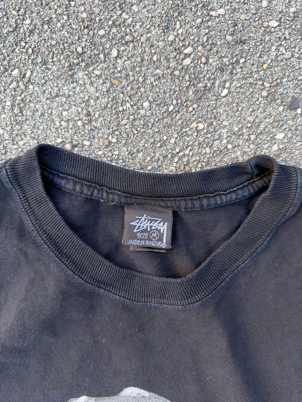 Stüssy – T-Rex „Big and Meaty" Pigment Dyed Tee (Black)