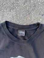 Stüssy – T-Rex „Big and Meaty" Pigment Dyed Tee (Black)