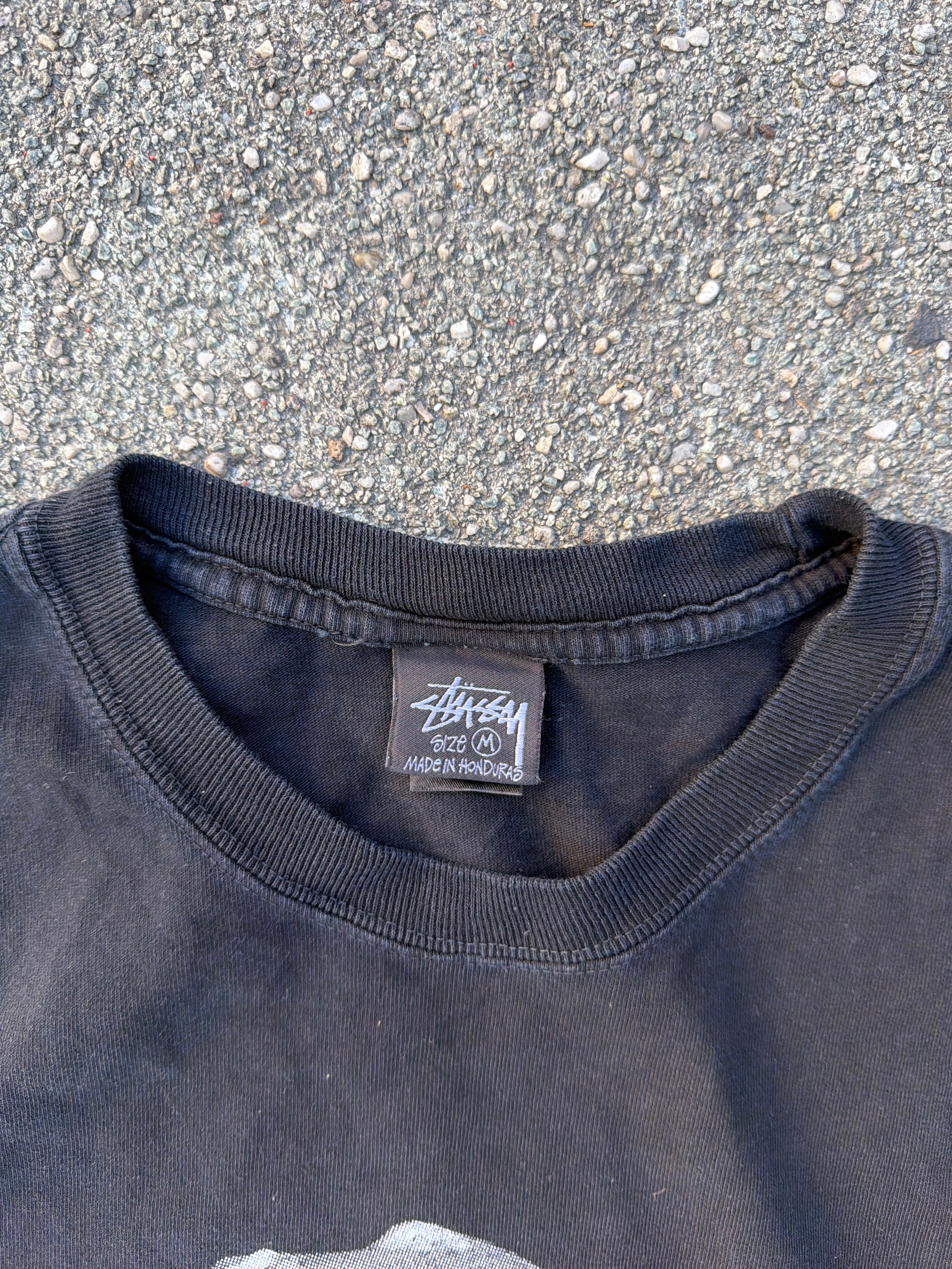 Stüssy – T-Rex „Big and Meaty" Pigment Dyed Tee (Black)